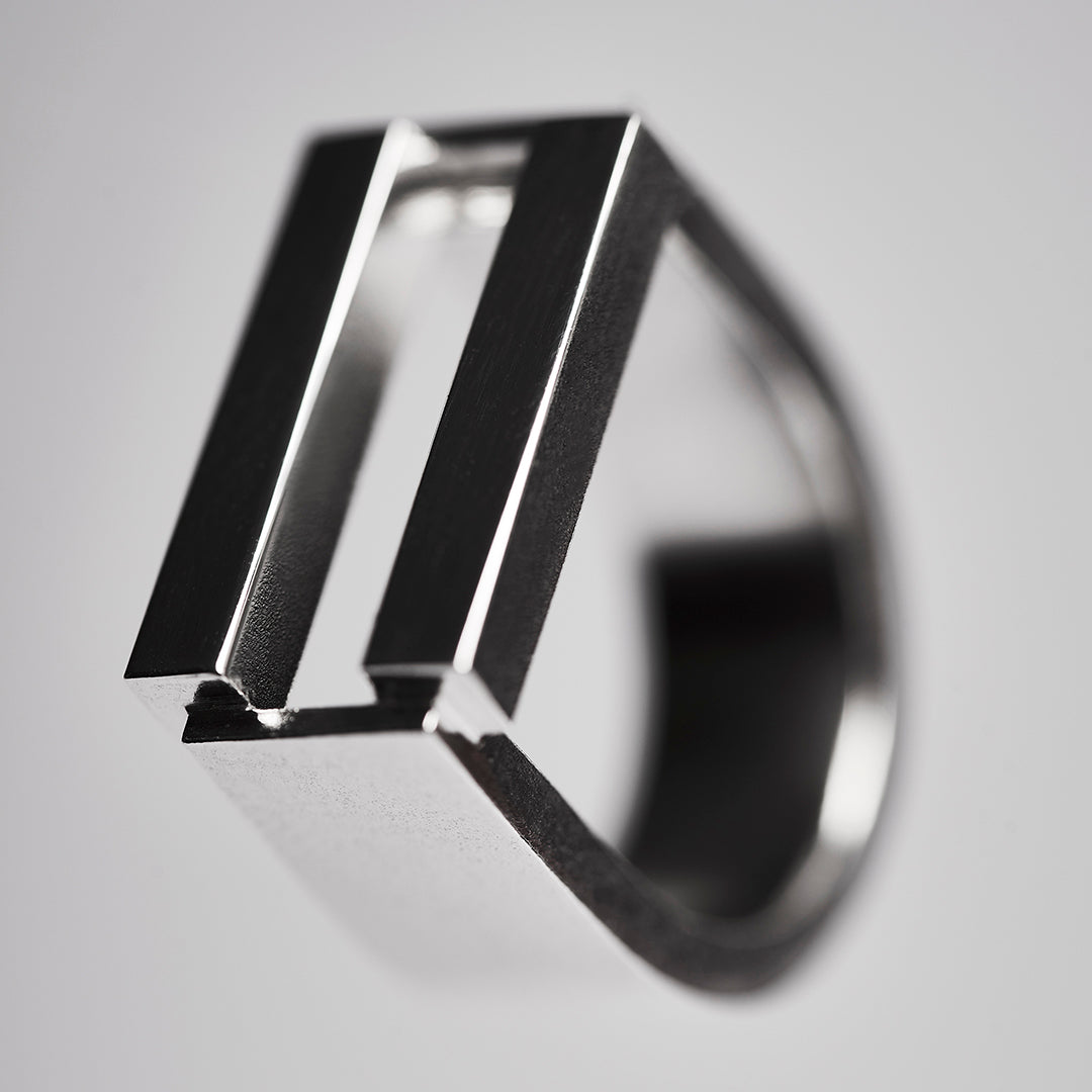 Bold, silver, equality ring with parallel bars. 